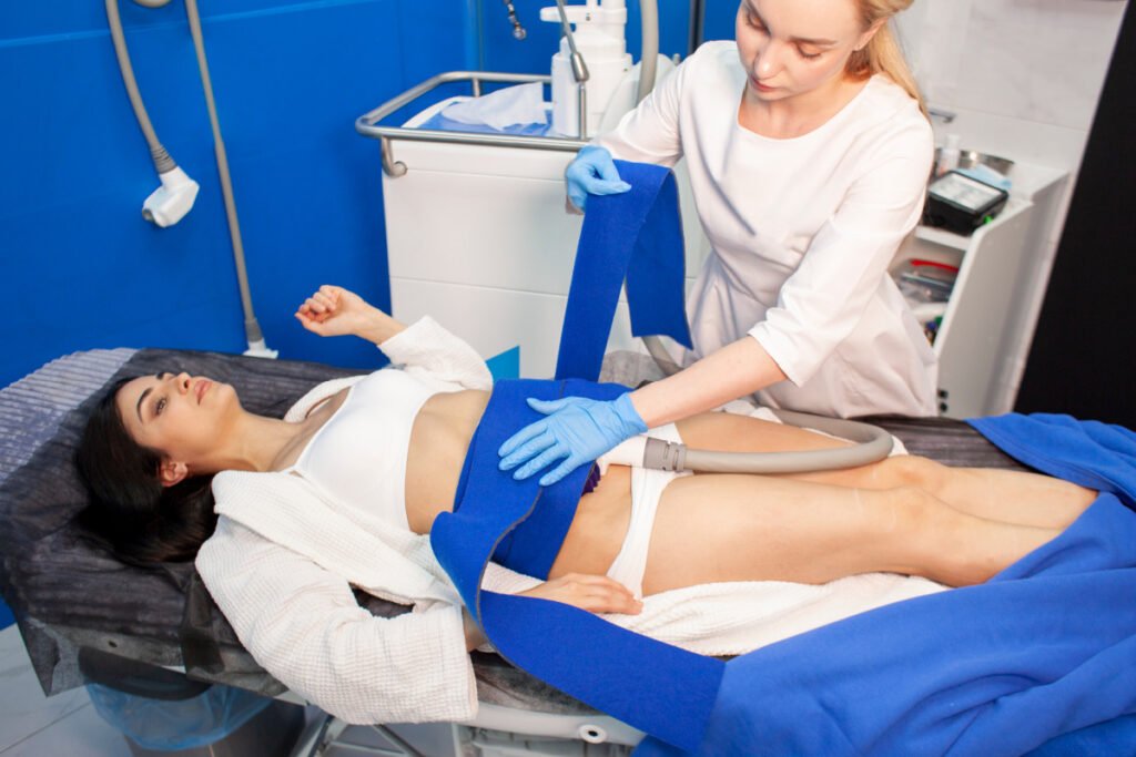 Woman getting a CoolSculpting treatment at a medical spa
