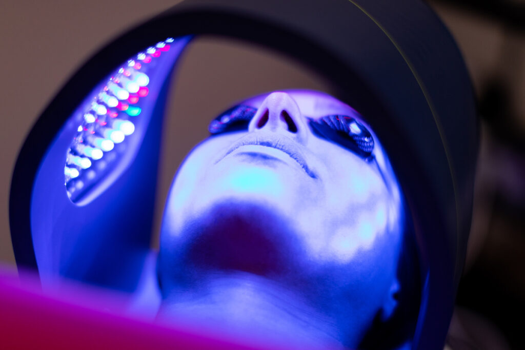 Close up of a woman during a professional-grade LED light therapy session at a medical spa